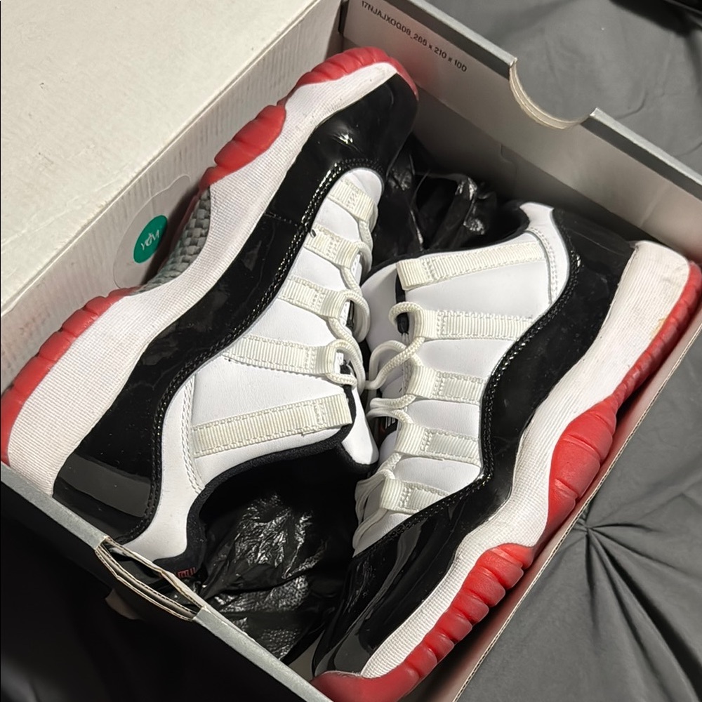 Black and White Sneakers with Red Soles